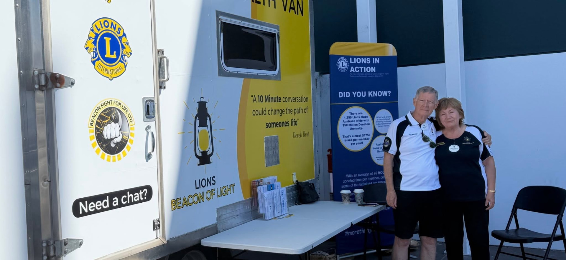 Lions volunteers beside the Lions Beacon of Light van